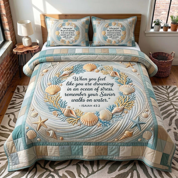 Coastal Blessings quilted 3-piece bedding set on a made bed in a light coastal bedroom