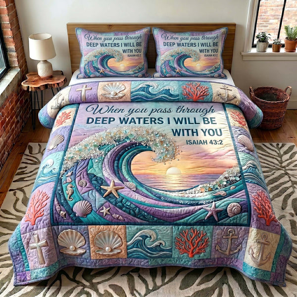 Coastal Blessings quilted 3-piece bedding set on a made bed in a light coastal bedroom