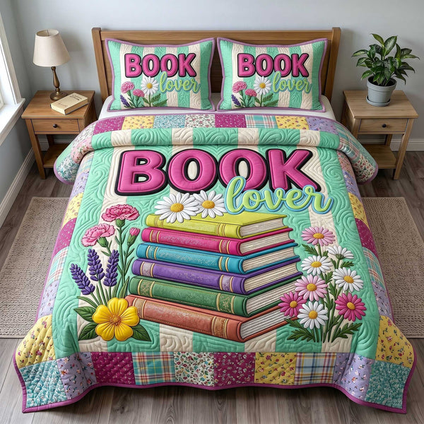 Bookish Soul quilted 3-piece bedding set on a made bed with two matching pillow shams