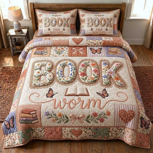 Bookish Soul quilted 3-piece bedding set on a made bed with two matching pillow shams