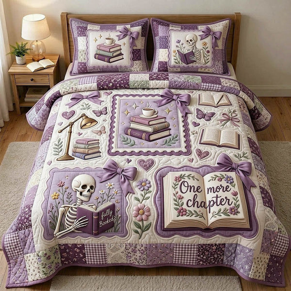 Bookish Soul quilted 3-piece bedding set on a made bed with two matching pillow shams
