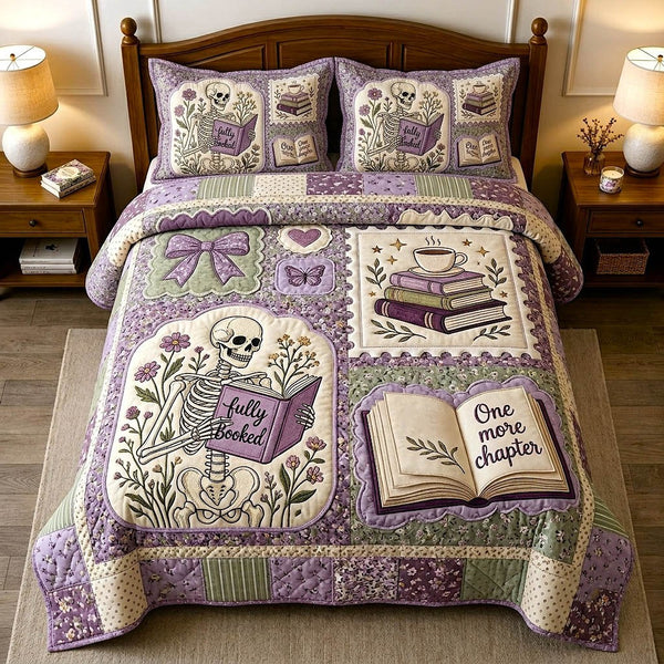 Bookish Soul quilted 3-piece bedding set on a made bed with two matching pillow shams