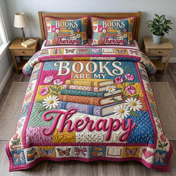 Bookish Soul quilted 3-piece bedding set on a made bed with two matching pillow shams