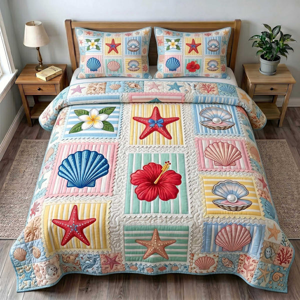 Coastal Serenity quilted 3-piece bedding set on a made bed in a light coastal bedroom