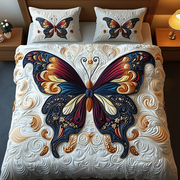 Butterfly Dreamscape quilted 3-piece bedding set on a made bed with two matching pillow shams