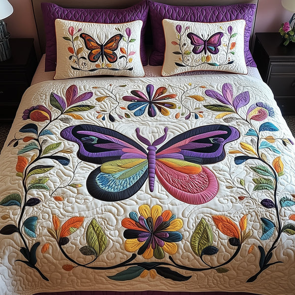 Butterfly quilted 3-piece bedding set on a made bed with two matching pillow shams