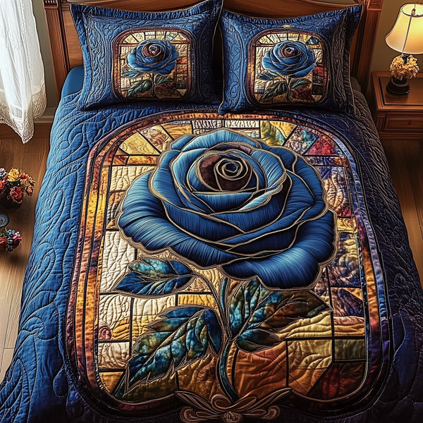 Blue Rose Dreamscape quilted 3-piece bedding set on a made bed with two matching pillow shams