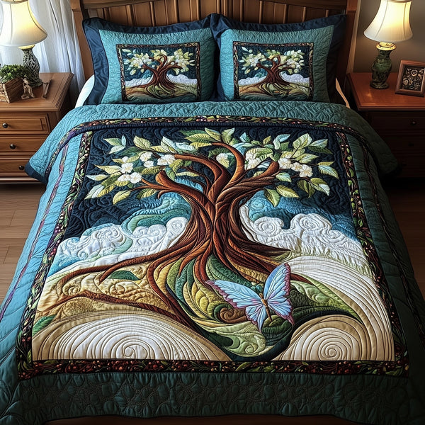 Ancient Tree Of Life quilted 3-piece bedding set on a made bed with two matching pillow shams