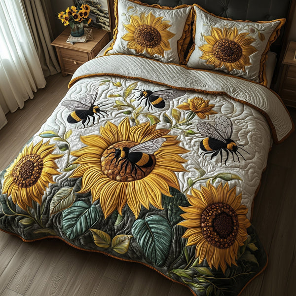 Buzzing Blossoms quilted 3-piece bedding set on a made bed with two matching pillow shams