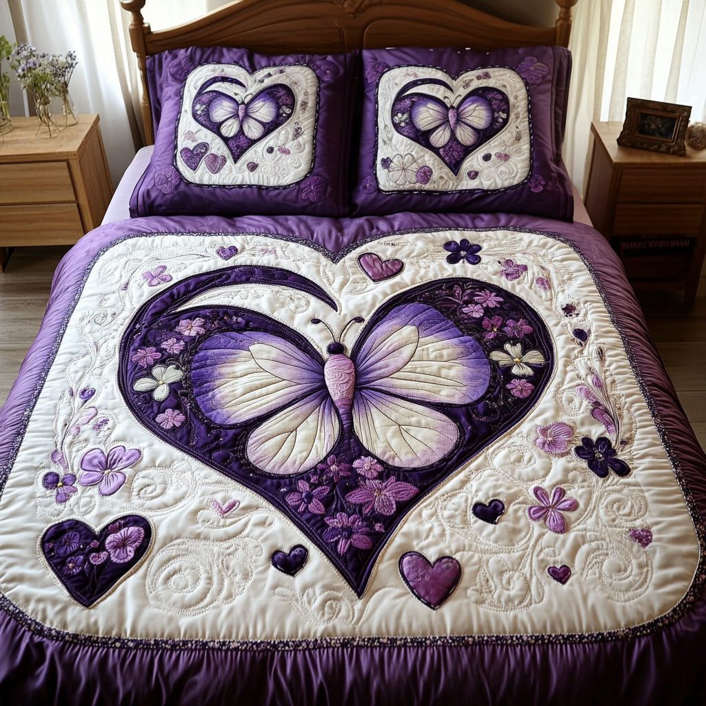 A Love That Blooms quilted 3-piece bedding set on a made bed with two matching pillow shams