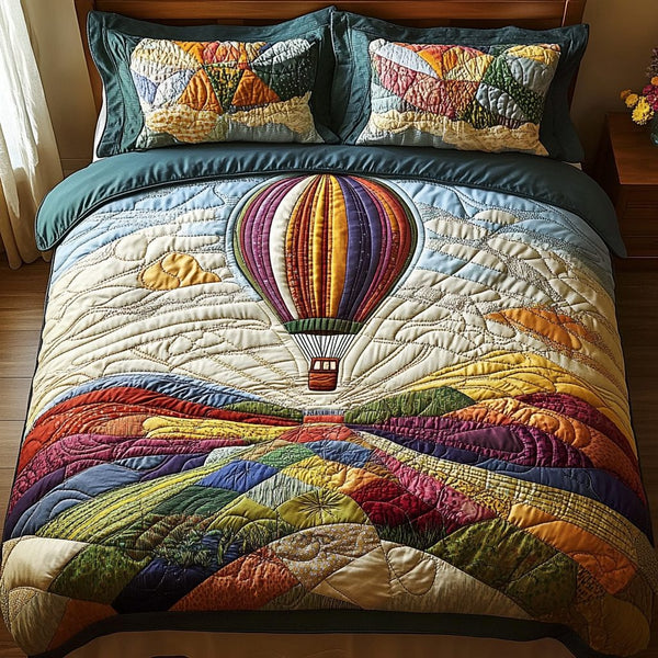 Above the Clouds quilted 3-piece bedding set on a made bed with two matching pillow shams