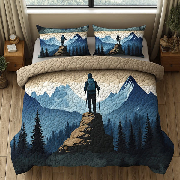Adventure Ridge quilted 3-piece bedding set on a made bed in a winter-styled bedroom