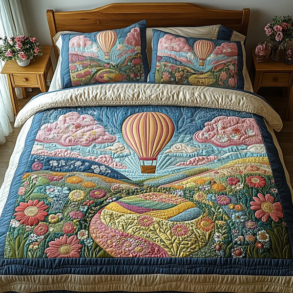 Aerial Majesty quilted 3-piece bedding set on a made bed with two matching pillow shams