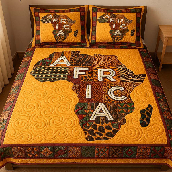 Africa Lettered Pride quilted 3-piece bedding set on a made bed with two matching pillow shams