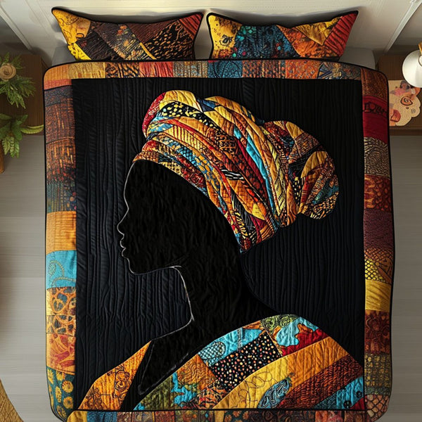 African Elegance quilted 3-piece bedding set on a made bed with two matching pillow shams
