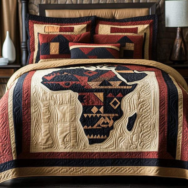 African Essence quilted 3-piece bedding set on a made bed with two matching pillow shams