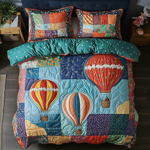 Airborne Patchwork quilted 3-piece bedding set on a made bed in a farmhouse bedroom