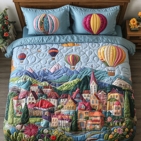 Airy Retreat quilted 3-piece bedding set on a made bed with two matching pillow shams