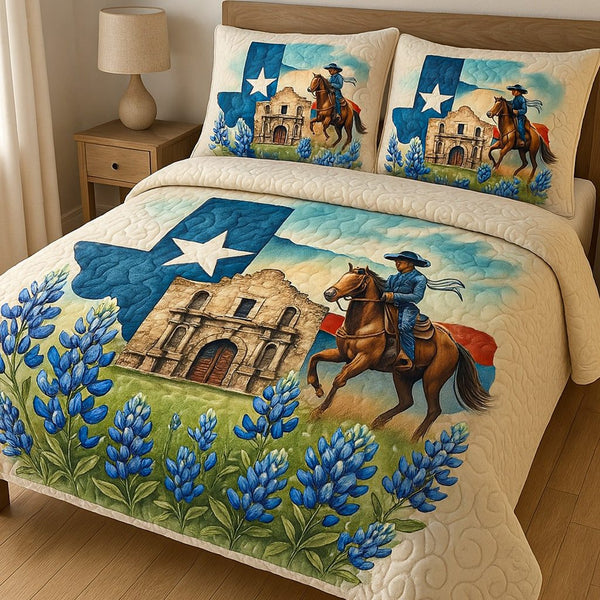 Alamo Pride quilted 3-piece bedding set on a made bed with two matching pillow shams