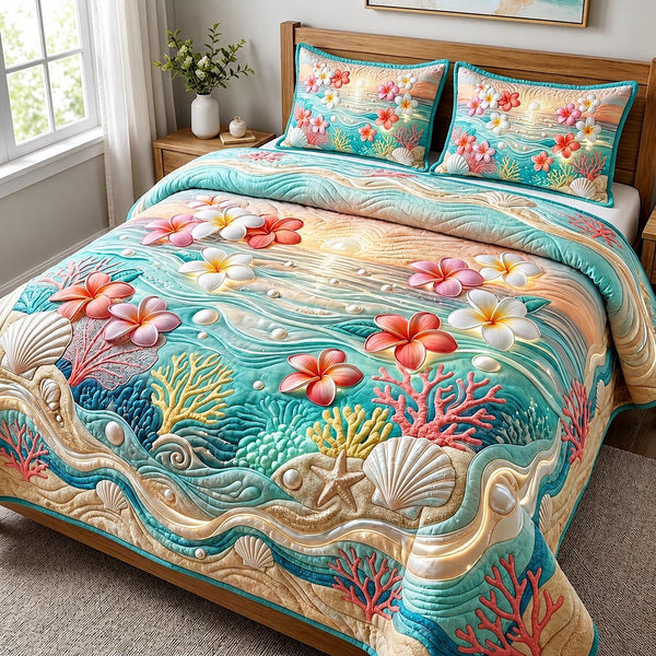 Aloha Blossom quilted 3-piece bedding set on a made bed with two matching pillow shams