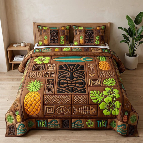 Aloha Breeze quilted 3-piece bedding set on a made bed with two matching pillow shams