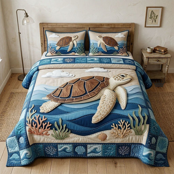 Aloha Breeze quilted 3-piece bedding set on a made bed with two matching pillow shams