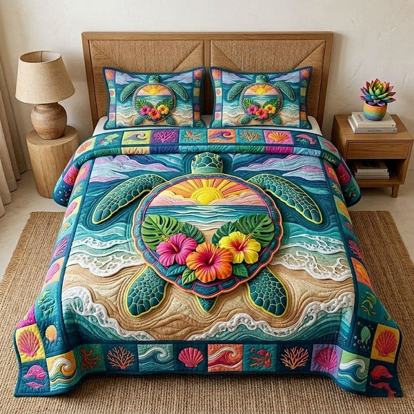 Aloha Breeze quilted 3-piece bedding set on a made bed with two matching pillow shams
