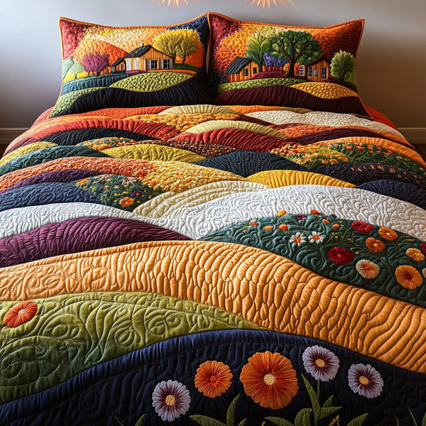 Amber Fields quilted 3-piece bedding set on a made bed with two matching pillow shams