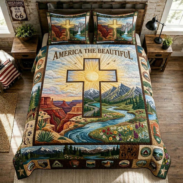 America The Beautiful quilted 3-piece bedding set on a made bed in a warmly lit bedroom