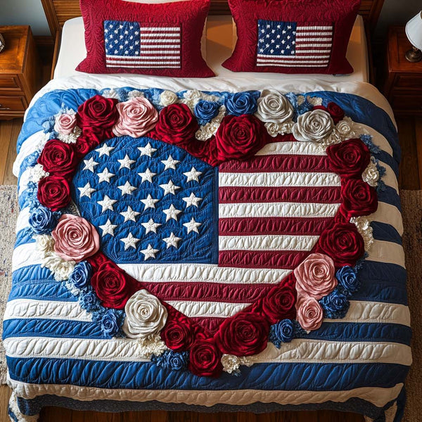 American Grace quilted 3-piece bedding set on a made bed in a warmly lit bedroom