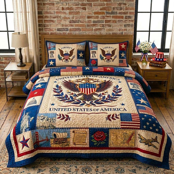 American Heritage Crest quilted 3-piece bedding set on a made bed in a warmly lit bedroom