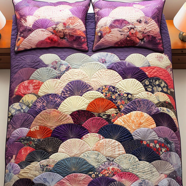 Amethyst Breeze quilted 3-piece bedding set on a made bed with two matching pillow shams