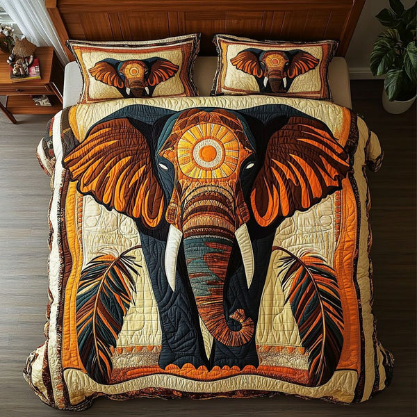 Ancestral Wisdom quilted 3-piece bedding set on a made bed with two matching pillow shams