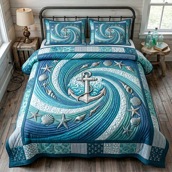 Anchor Breeze quilted 3-piece bedding set on a made bed in a light coastal bedroom