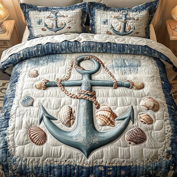 Anchor Of Comfort quilted 3-piece bedding set on a made bed in a light coastal bedroom