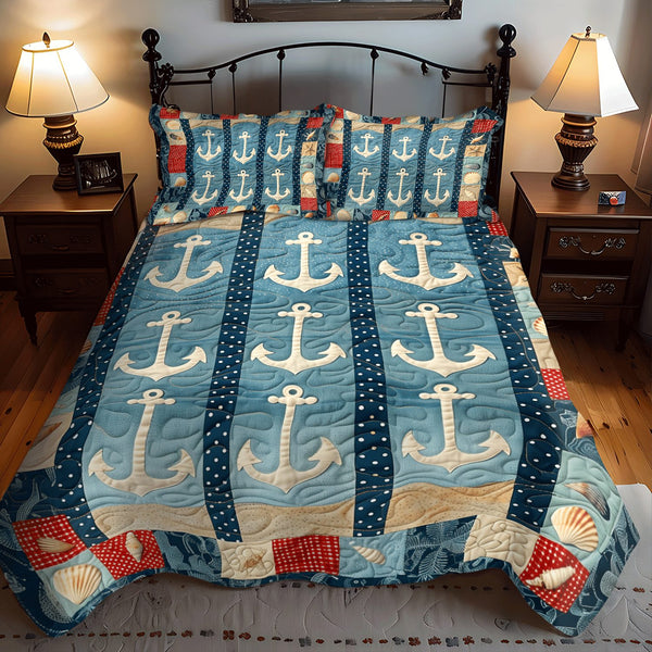 Anchors At Rest quilted 3-piece bedding set on a made bed in a light coastal bedroom