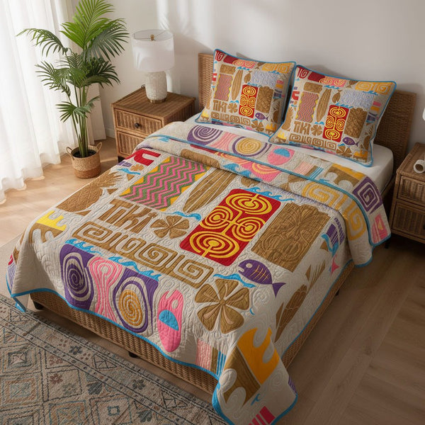 Ancient Totem quilted 3-piece bedding set on a made bed with two matching pillow shams