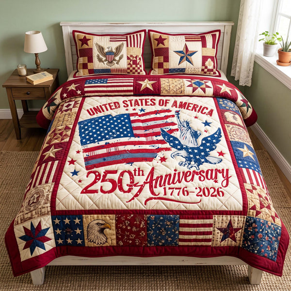 Anniversary Glory quilted 3-piece bedding set on a made bed with two matching pillow shams