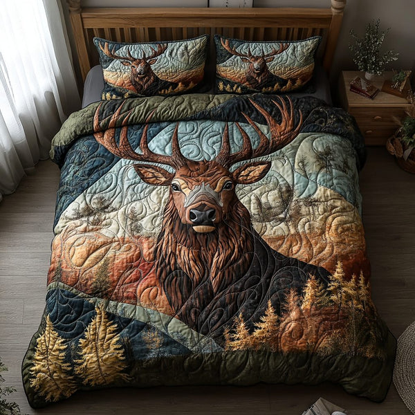 Antler Grace quilted 3-piece bedding set on a made bed with two matching pillow shams