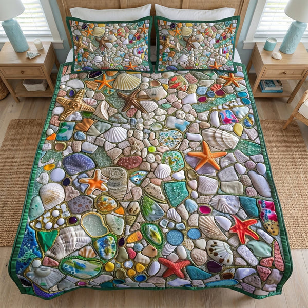 Aqua Aura quilted 3-piece bedding set on a made bed with two matching pillow shams