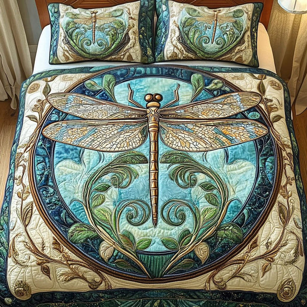 Aqua Dragonfly quilted 3-piece bedding set on a made bed with two matching pillow shams
