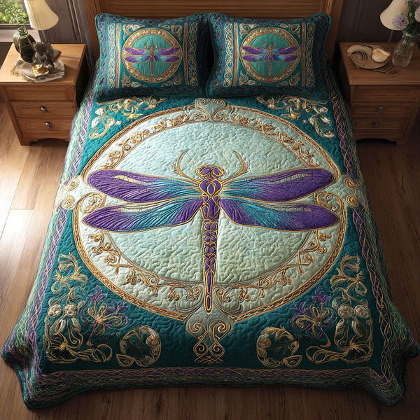 Aqua Dream quilted 3-piece bedding set on a made bed with two matching pillow shams