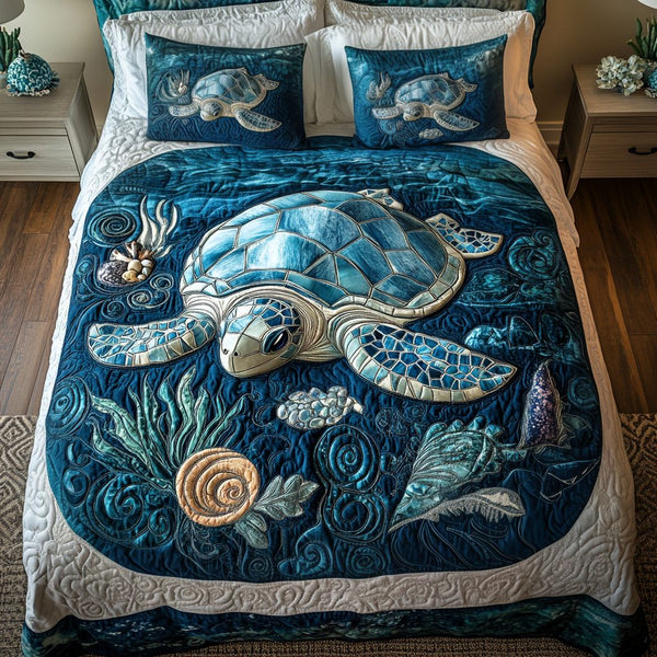 Aqua Drift quilted 3-piece bedding set on a made bed with two matching pillow shams