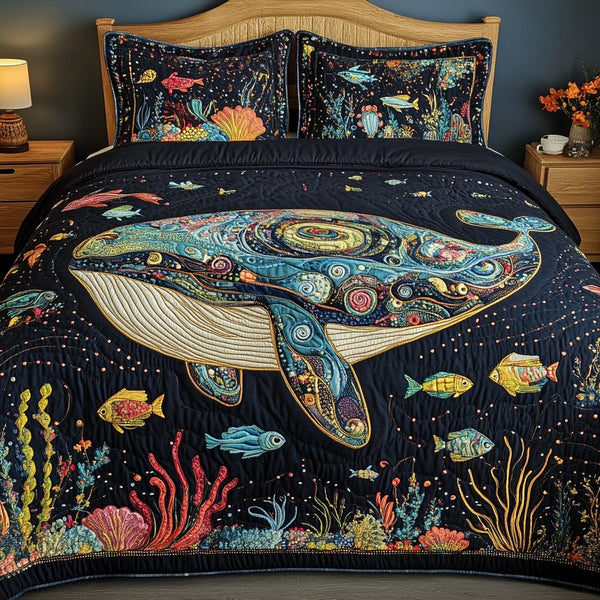 Aqua Drift quilted 3-piece bedding set on a made bed with two matching pillow shams