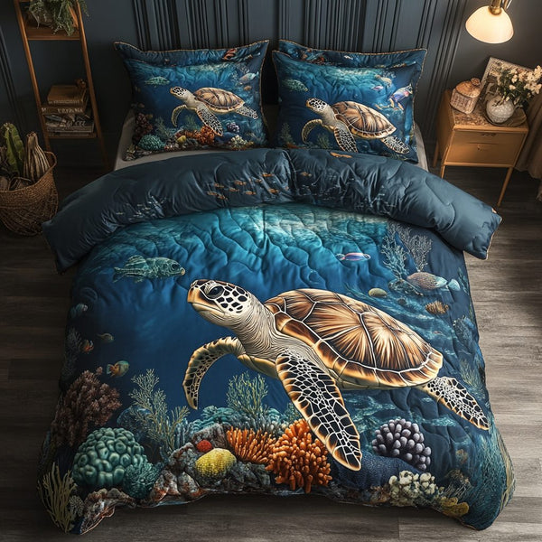 Aqua Explorer quilted 3-piece bedding set on a made bed with two matching pillow shams