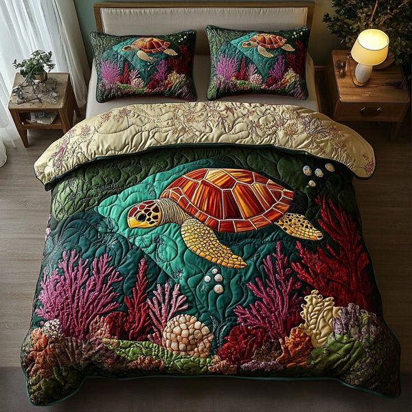 Aqua Explorer quilted 3-piece bedding set on a made bed with two matching pillow shams