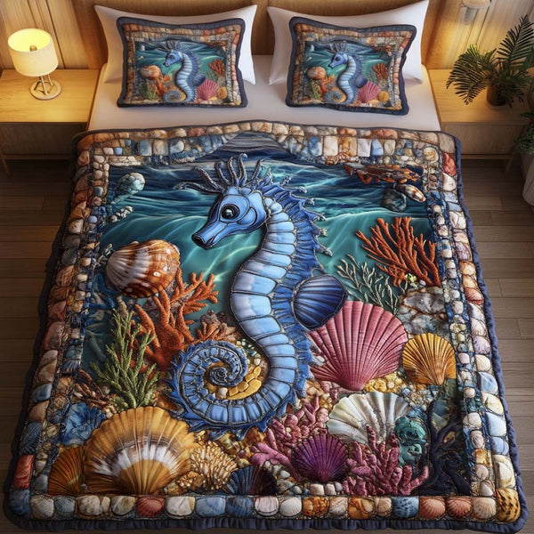 Aqua Haven quilted 3-piece bedding set on a made bed with two matching pillow shams
