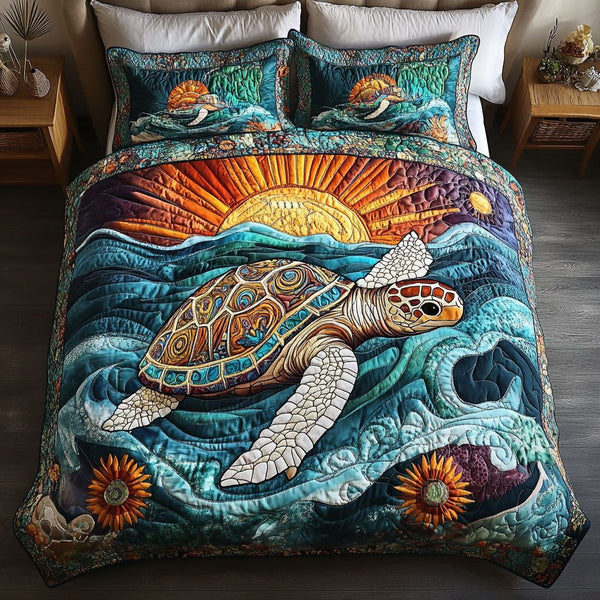 Aqua Journey quilted 3-piece bedding set on a made bed with two matching pillow shams