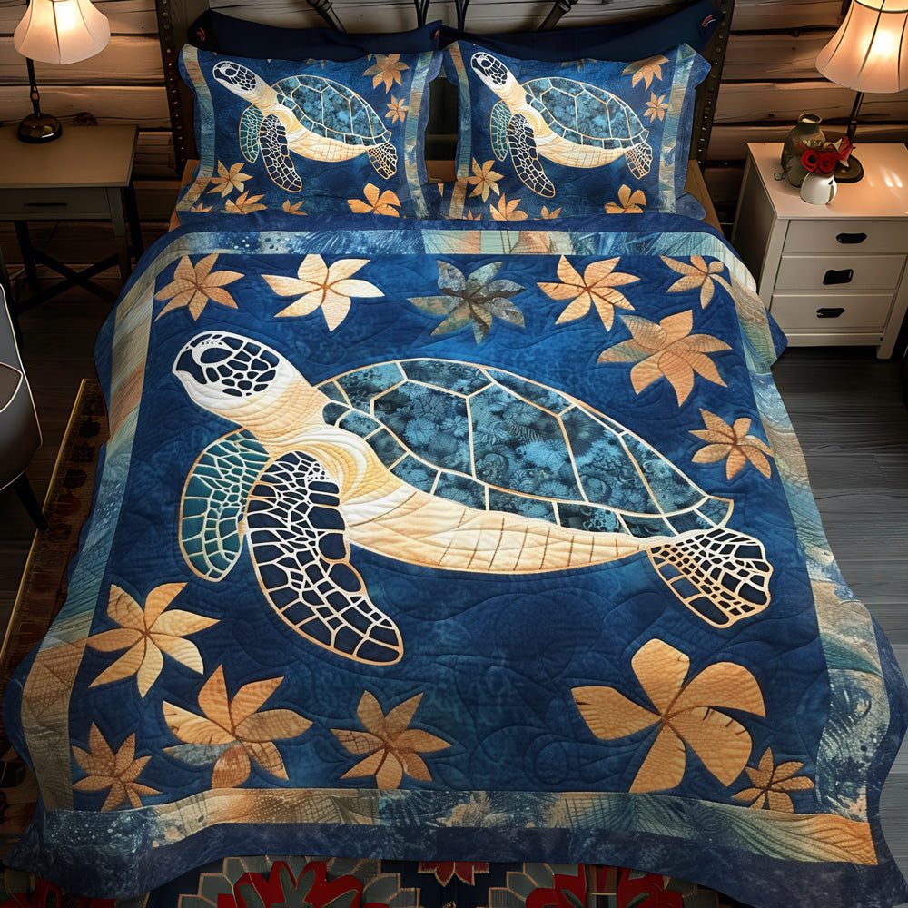 Aqua Journey quilted 3-piece bedding set on a made bed with two matching pillow shams