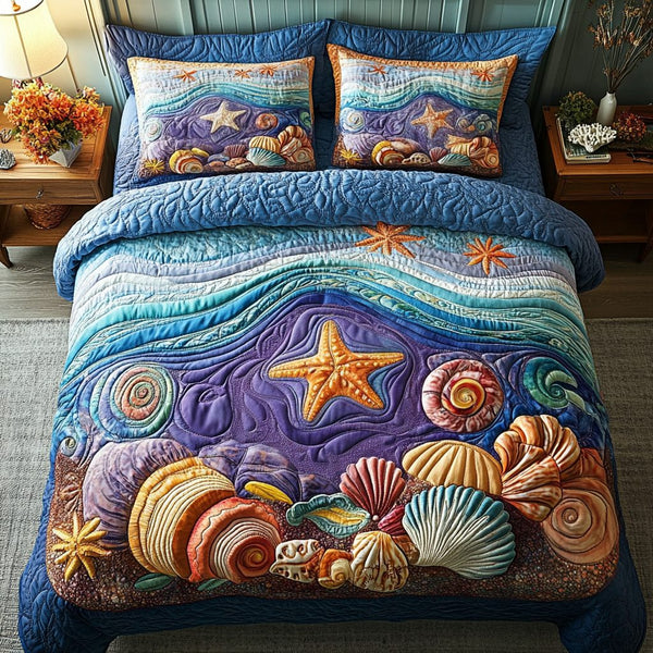 Aqua Retreat quilted 3-piece bedding set on a made bed with two matching pillow shams
